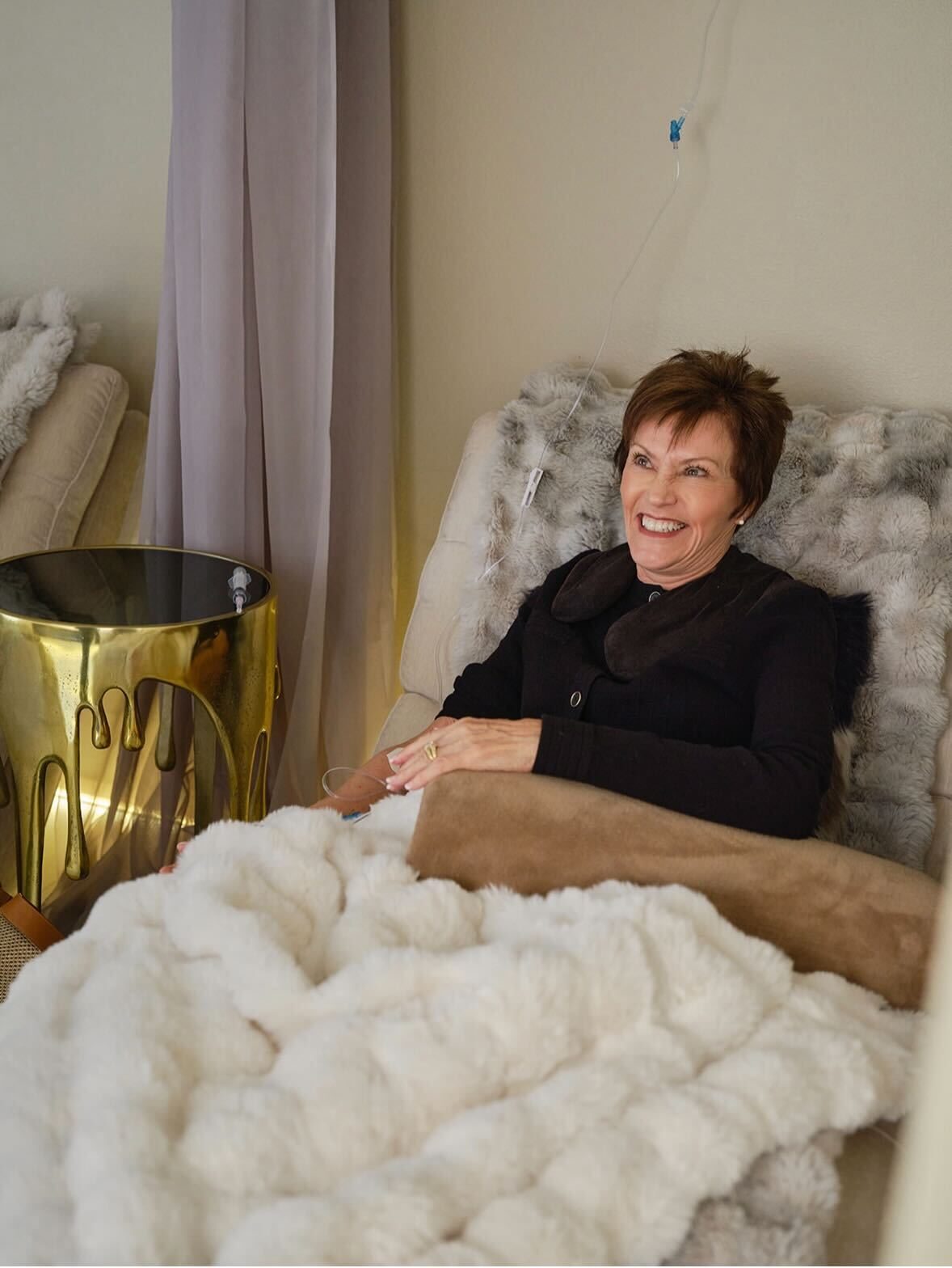 Patient receiving IV therapy in luxury lounge at Zen Regenerative Wellness